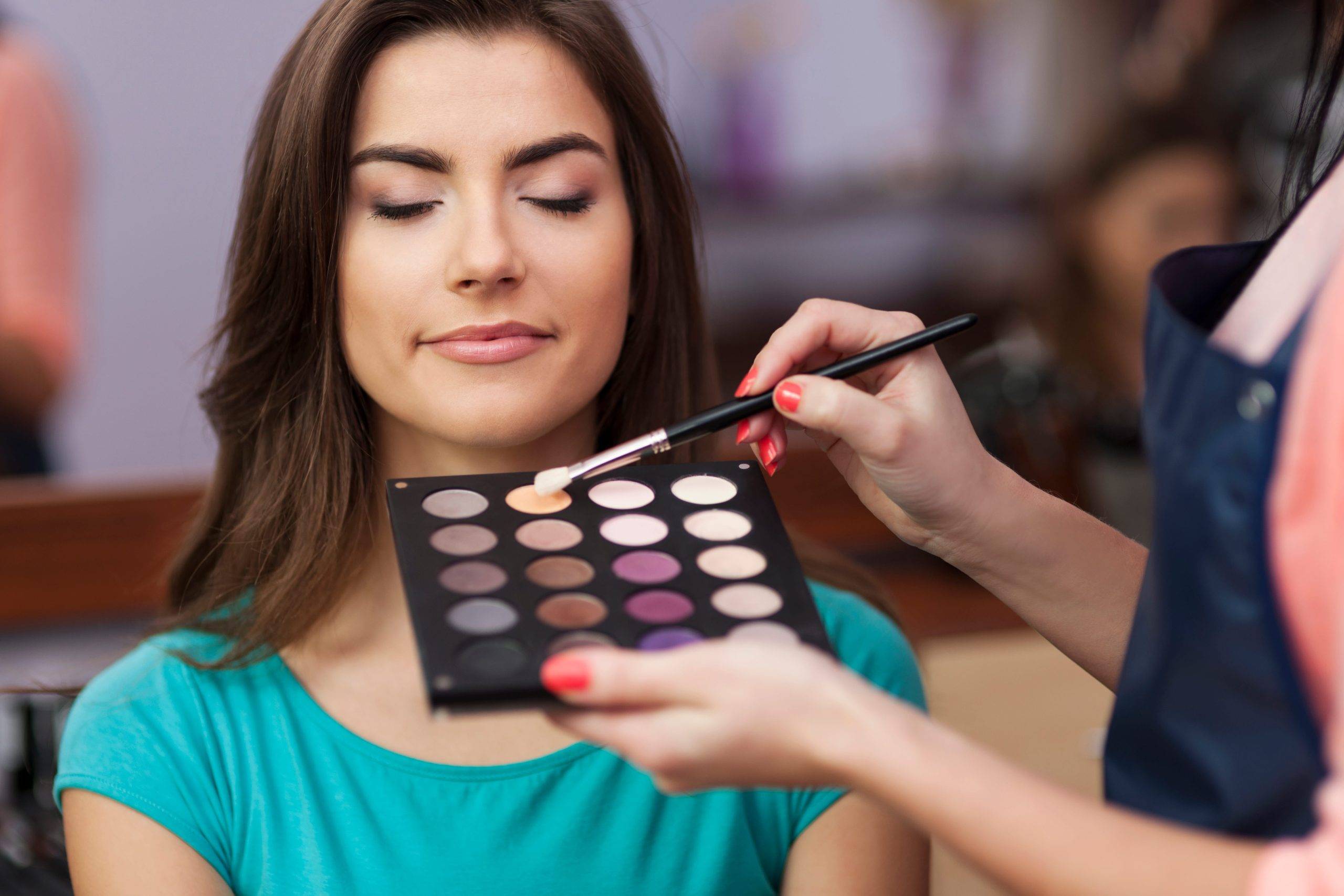 Woman having makeup in a salon